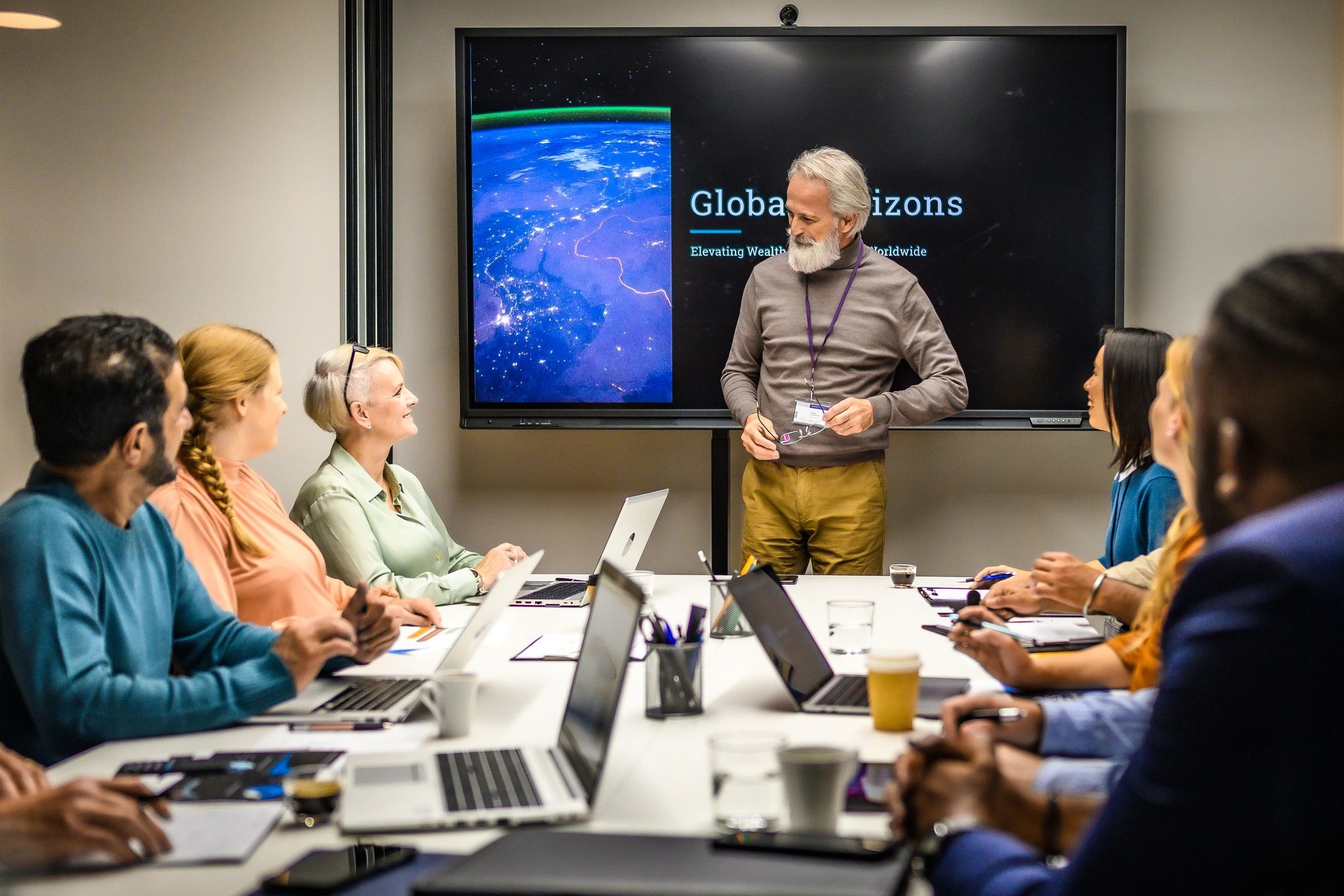 Senior executive presenting strategy in a meeting room